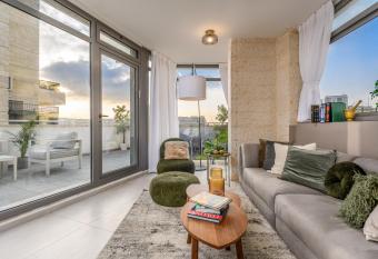 Stunning City Apartment With Huge Terrace View allows 18 year olds to book a room