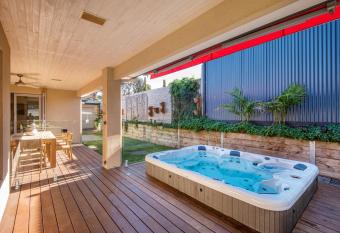 Luxury And Style in Rye with Large Spa has rooms with a private hot tub