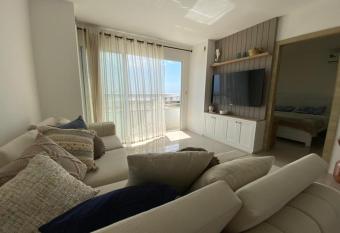 Amazing View Beach Apartment has rooms with a private hot tub