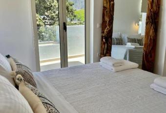 Thealos Santorini ( close to square) allows 18 year olds to book a room