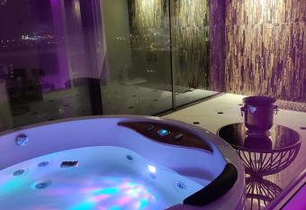 Premium Sky Jacuzzi Apartment has rooms with a private hot tub