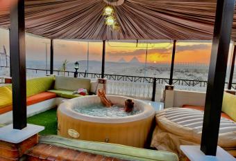 Private Oasis Panoramic Pyramids View RelaxJacuzzi has rooms with a private hot tub