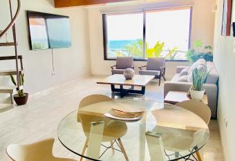 Luxury beachfront Apartment has rooms with a private hot tub