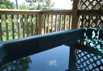 C16, Two bedroom, two bath, log-sided Harbor North luxury cottage with hot tub, cottage has rooms with a private hot tub