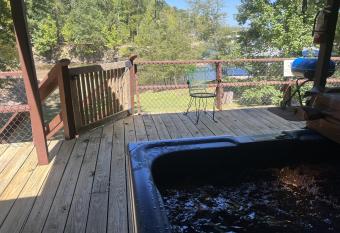 Harbor House, a secluded three bedroom, two bath home on the lake home has rooms with a private hot tub