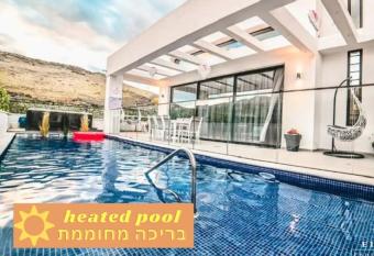                        -                                                                                                            - Luxurious and designed 5Bdrm villa with a spa jacuzzi and a heated pool near the Sea of Galilee allows 18 year olds to book a room