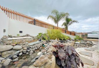 Elegant beach house in long bay has rooms with a private hot tub