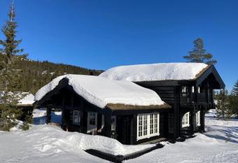 Log cabin on Natrudstilen Sjusj  entrail outside has Balcony rooms