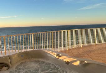 Newly Renovated - Luxury Beachfront Condo - 5 Star Host has rooms with a private hot tub
