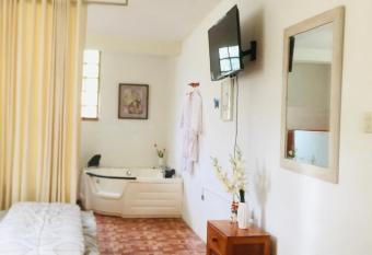 Hotel Plaza Laguna Azul has rooms with a private hot tub