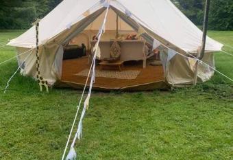 French Tent secret garden glamping has rooms with a private hot tub