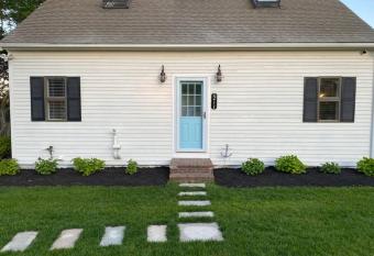 Sophisticated, Private Cape Cod living! Front yard has Balcony rooms
