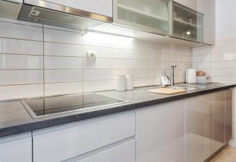 Airy 2-BR Apt w/ Open Layout & Modern Design has rooms with a private hot tub