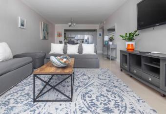 Poolside 2BR Oasis, Steps from the Beach has Balcony rooms